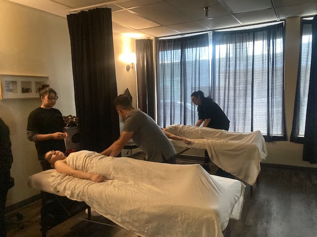 Massage therapy students practice at Milan Institute