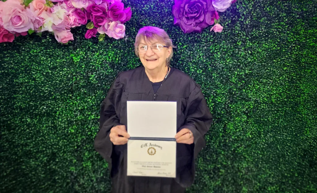 Las Vegas Nail Tech student Cynthia poses with her C4L diploma.