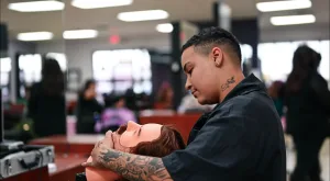 Student barber in El Paso practices beard and mustache trims