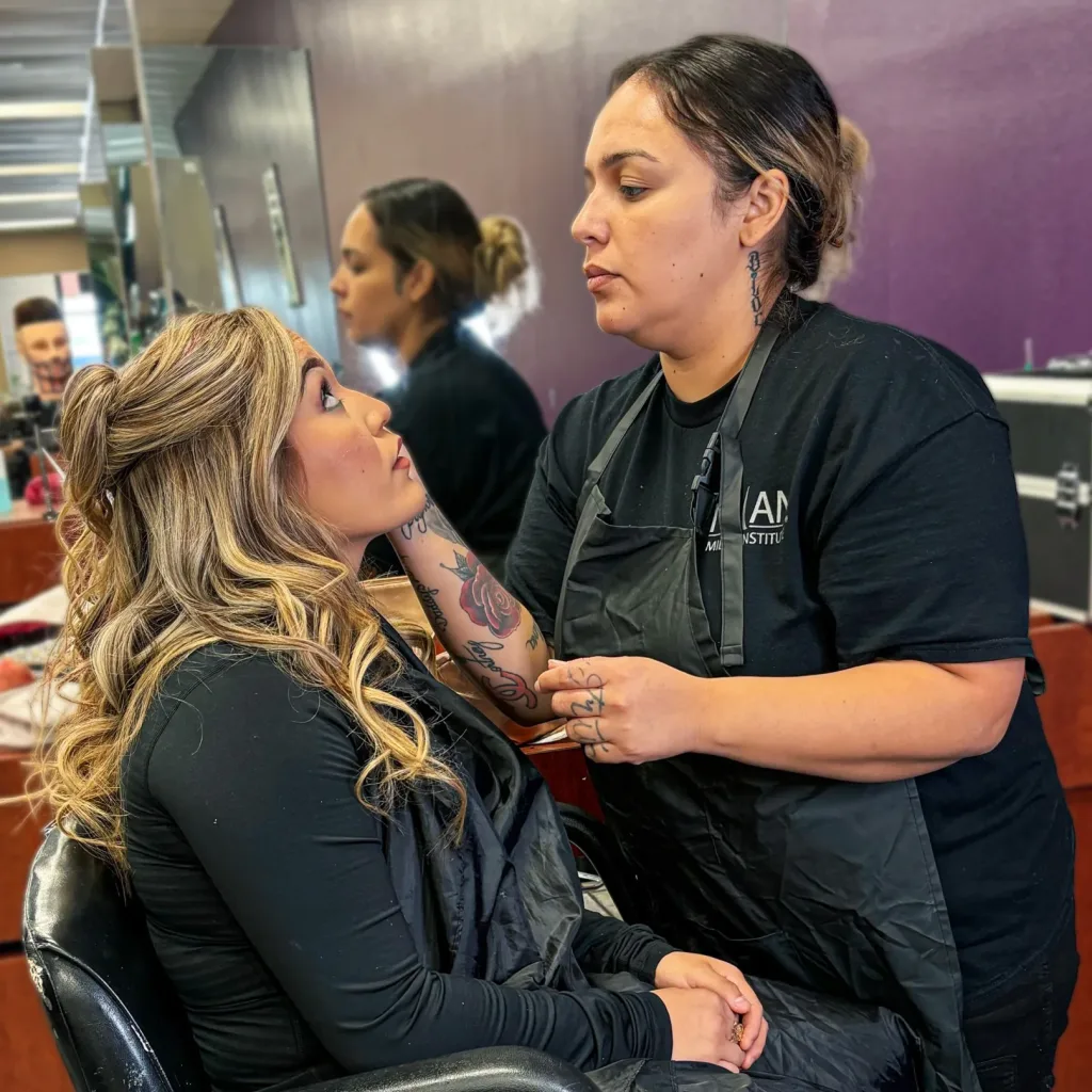 Cosmetology students during Phase 2 practice hair and makeup skills.