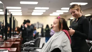 Student begins a cosmetology hair appointment in the student salon in Clovis