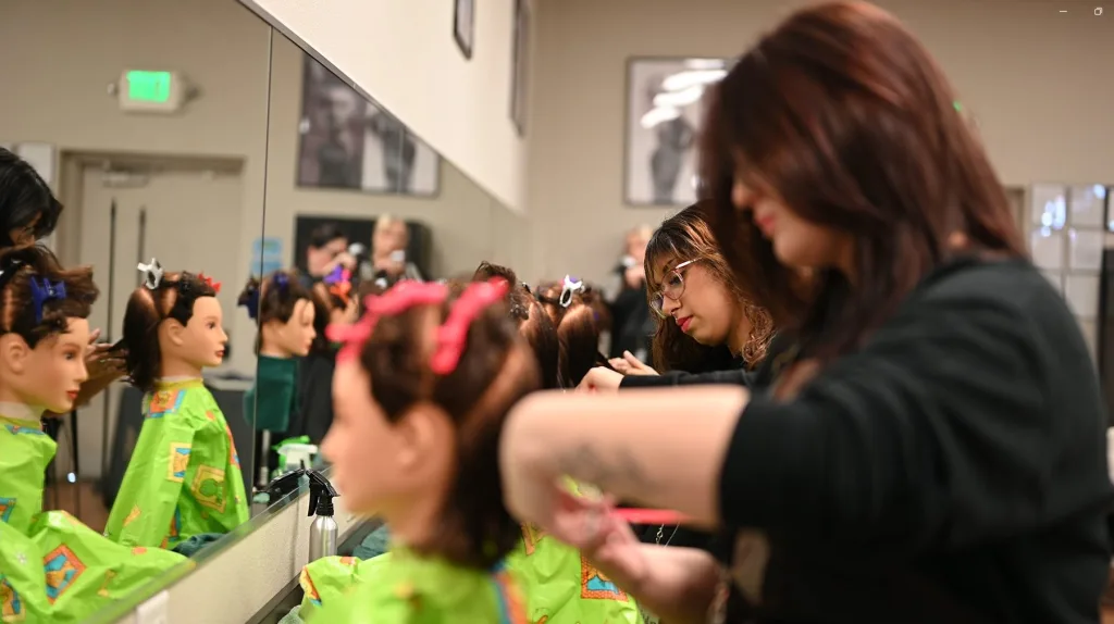 Cosmetology students in Nevada practice on mannequins in the salon