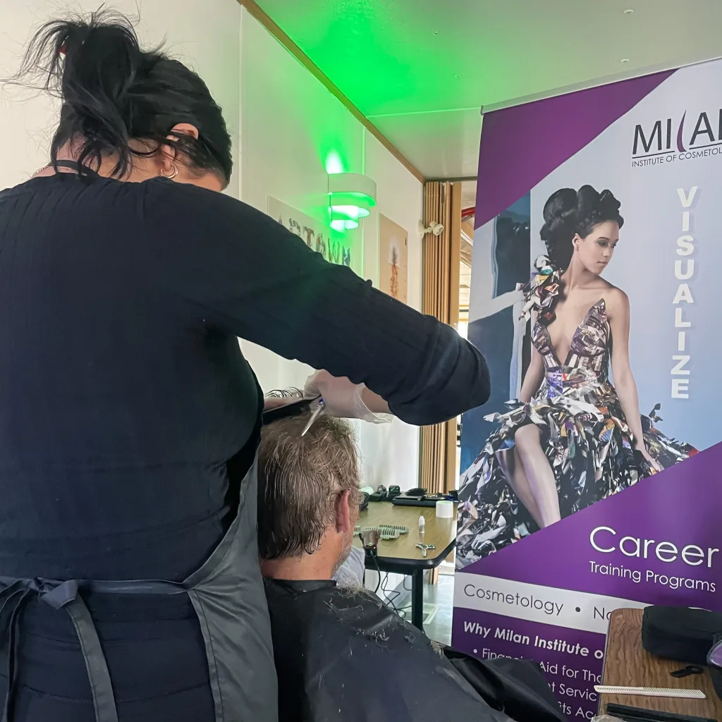 Milan Institute of Cosmetology students in Reno participate in a community service event to give free haircuts