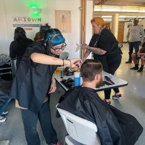 Cosmetology students in Reno give back to the community during an event that offered free haircuts