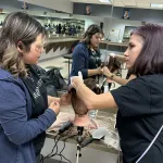 A cosmetology instructor works with a student in San Antonio, Texas.