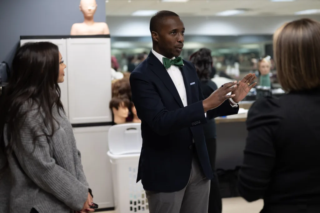 Dr. Kirk Nooks visits with campus faculty members at San Antonio Ingram campus